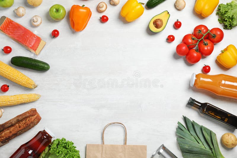 Frame made with fresh vegetables and other products on grey background, flat lay. Space for text stock image