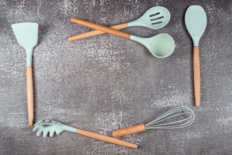 Kitchen utensils, home kitchen tools, mint rubber accessories on dark  background. Restaurant, cooking, culinary, kitchen theme. Silicone spatulas  and brushes, free space for text Stock Photo by ©Magryt_Artur 441739004