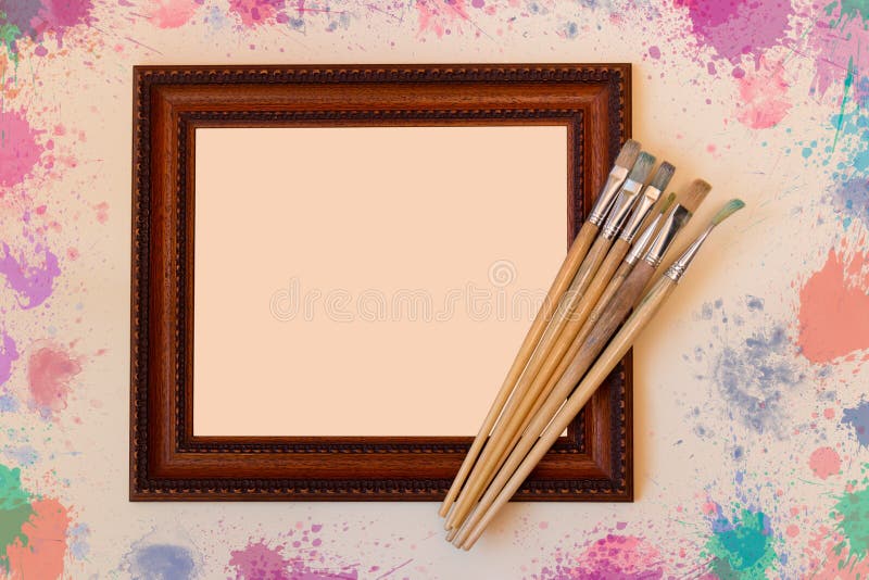 Frame with paint brushes on beige background stock images Frame with paint brushes on beige background stock images