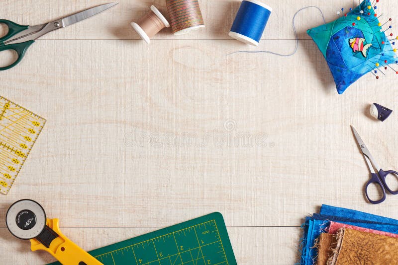 Frame of Quilting Accessories with Space for Text on Creamwhite Wooden