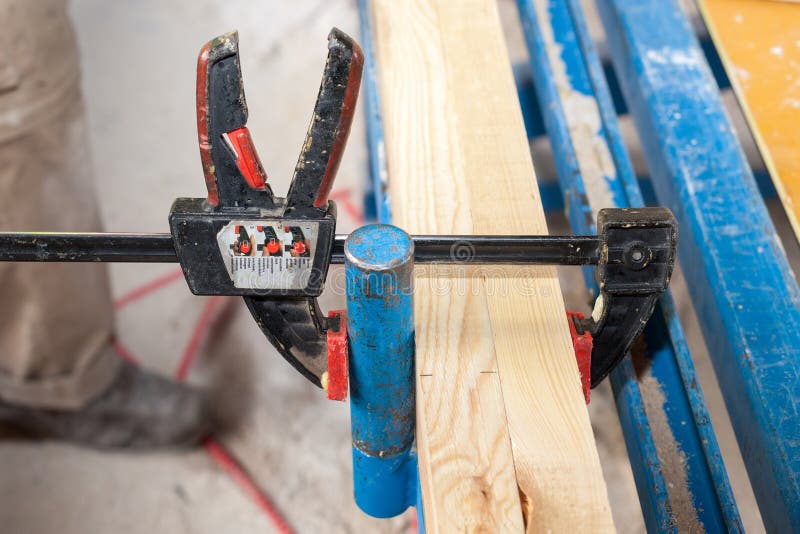 Clamp holding wood stock photo. Image of tough, construct 13538296