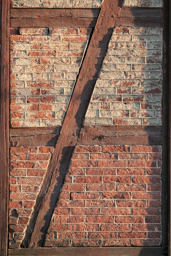 Old brick wall framed in painted wood. Old brick wall framed in painted wood