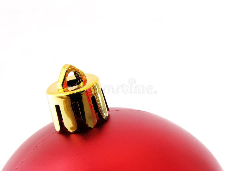 Red christmas bauble fragment at the white background. Red christmas bauble fragment at the white background