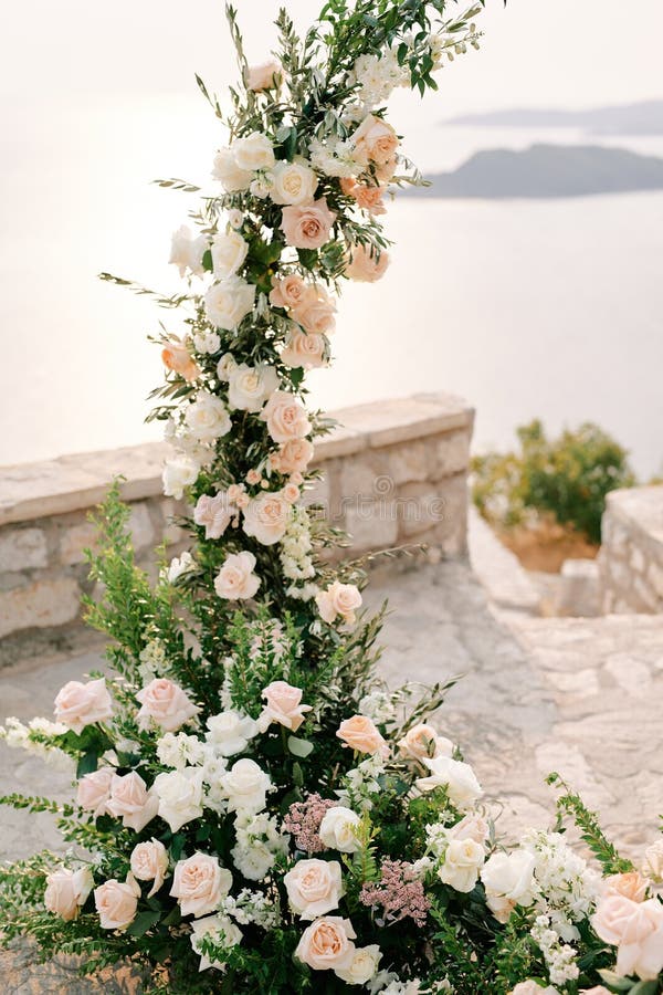 Fragment of a round wedding arch standing on an observation deck above the sea. High quality photo. Fragment of a round wedding arch standing on an observation deck above the sea. High quality photo