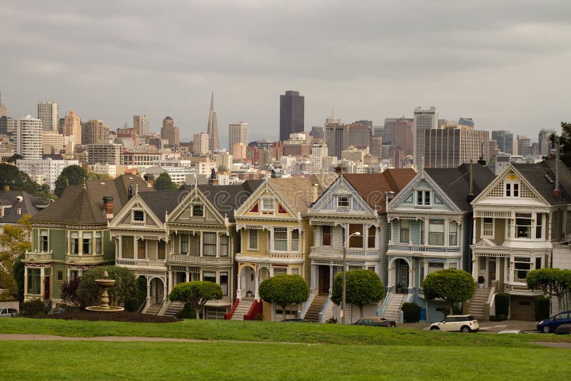 Painted Ladies Row Houses by Alamo Square with San Francisco Skyline. Painted Ladies Row Houses by Alamo Square with San Francisco Skyline