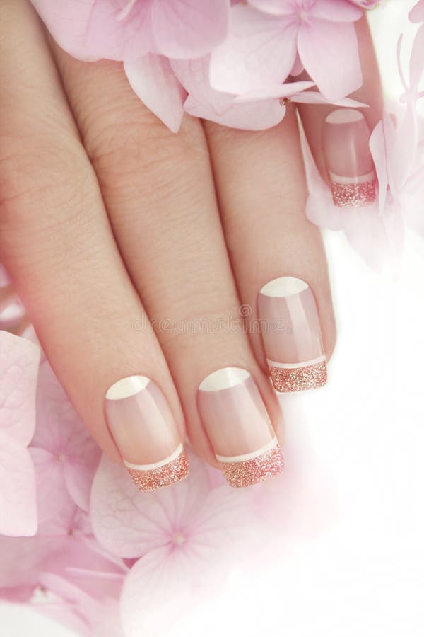 Francuski manicure z błyskotliwością obrazy stock Francuski manicure z błyskotliwością obrazy stock