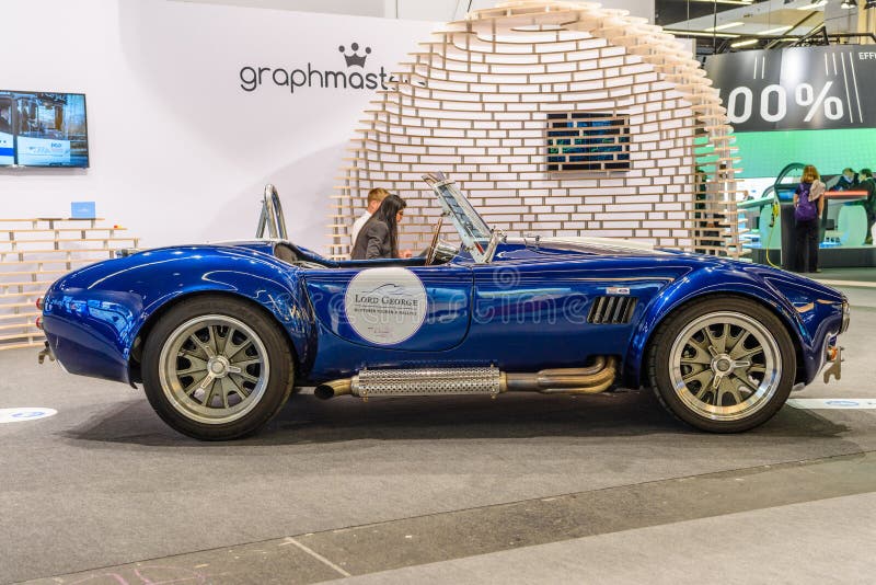 FRANKFURT, GERMANY - SEPT 2019: white blue SHELBY COBRA retro classic car cabrio roadster, IAA International Motor Show Auto