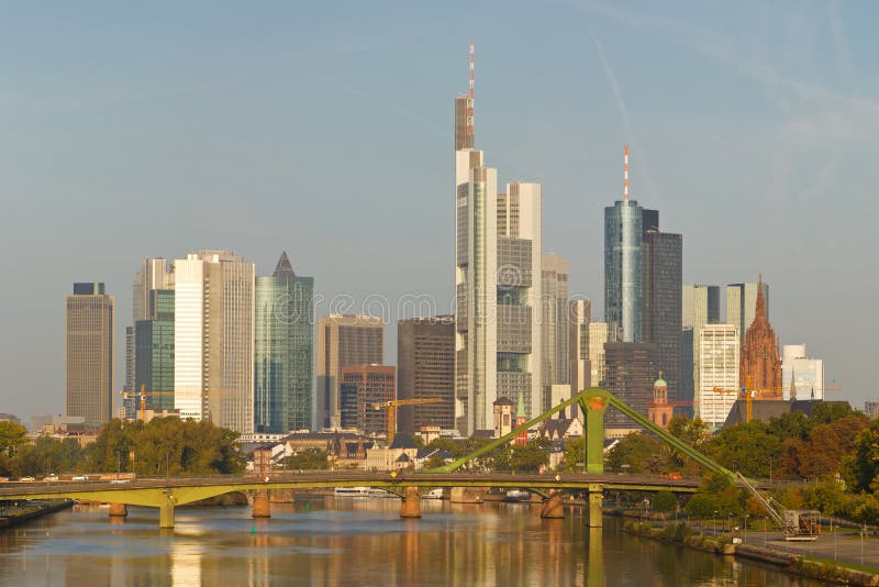 Skyline of Frankfurt reflecting in the Main River. Frankfurt is the financial center of Germany. All major German banks are headquartered in the city. Skyline of Frankfurt reflecting in the Main River. Frankfurt is the financial center of Germany. All major German banks are headquartered in the city.