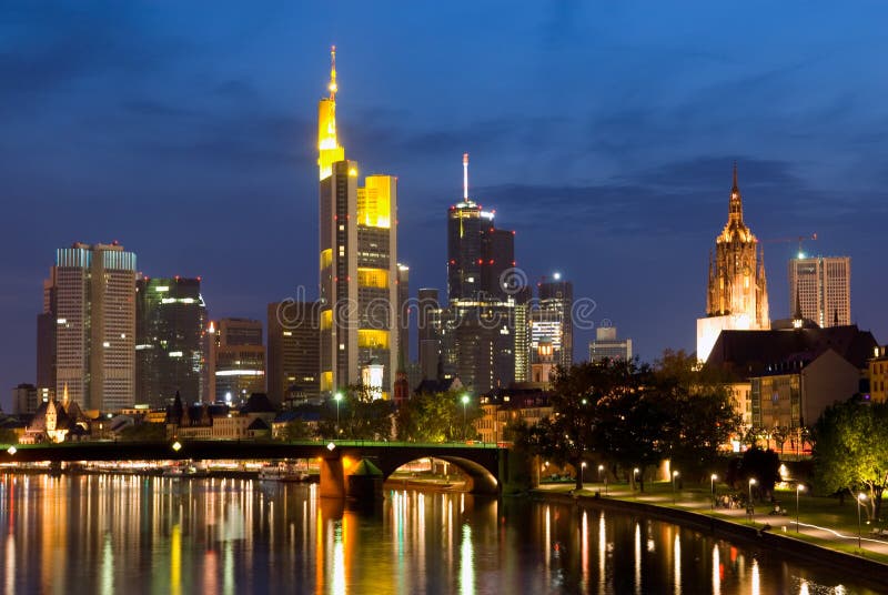 Frankfurt is home to ten skyscrapers, and shown here in the center is the Commerzbank which used to be the tallest building in Europe until 2005. The rest of the buildings comprise the Frankfurt skyline, shown here at twilight. Frankfurt is home to ten skyscrapers, and shown here in the center is the Commerzbank which used to be the tallest building in Europe until 2005. The rest of the buildings comprise the Frankfurt skyline, shown here at twilight.