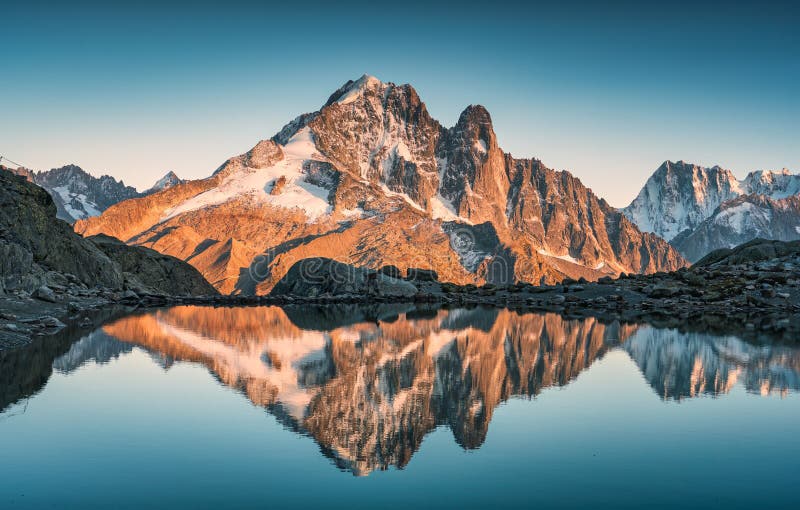 Majestic French alps landscape of Lac Blanc with Mont Blanc mountain range reflected on lake in the sunset at Haute Savoie, Chamonix, France. Majestic French alps landscape of Lac Blanc with Mont Blanc mountain range reflected on lake in the sunset at Haute Savoie, Chamonix, France