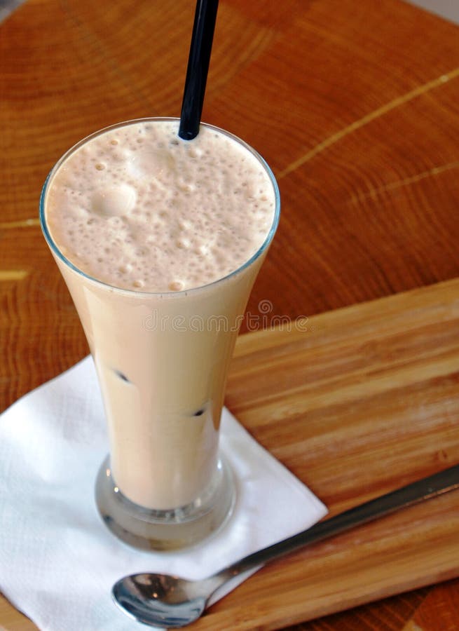 Frappe Coffee with Ice on a Glass on a Wooden Table Stock Image Image