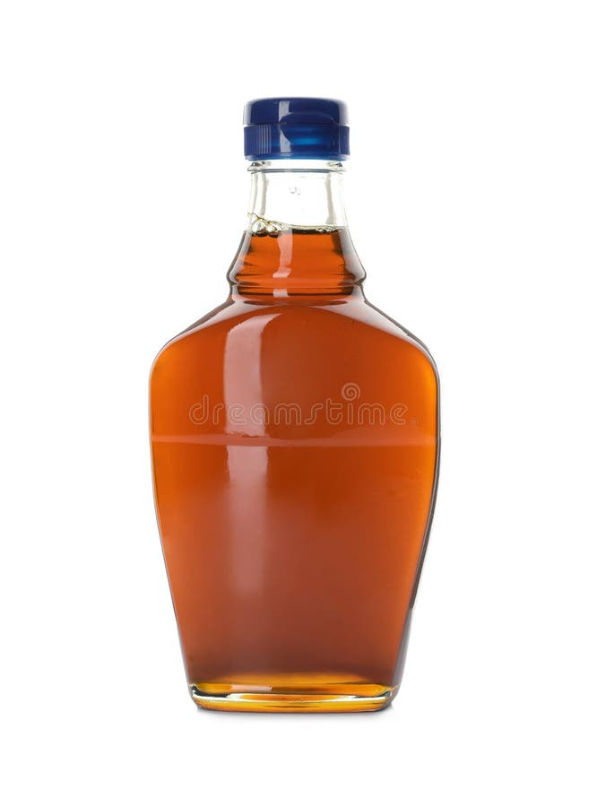 Frasco de jarabe de arce delicioso aislado en blanco fotos de archivo