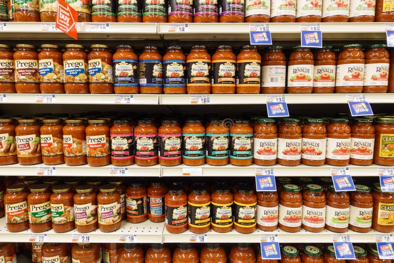 WILLIAMSBURG, VA, USA - CIRCA AUGUST 2015: Tomato sauce jars on supermarket shelves. WILLIAMSBURG, VA, USA - CIRCA AUGUST 2015: Tomato sauce jars on supermarket shelves.