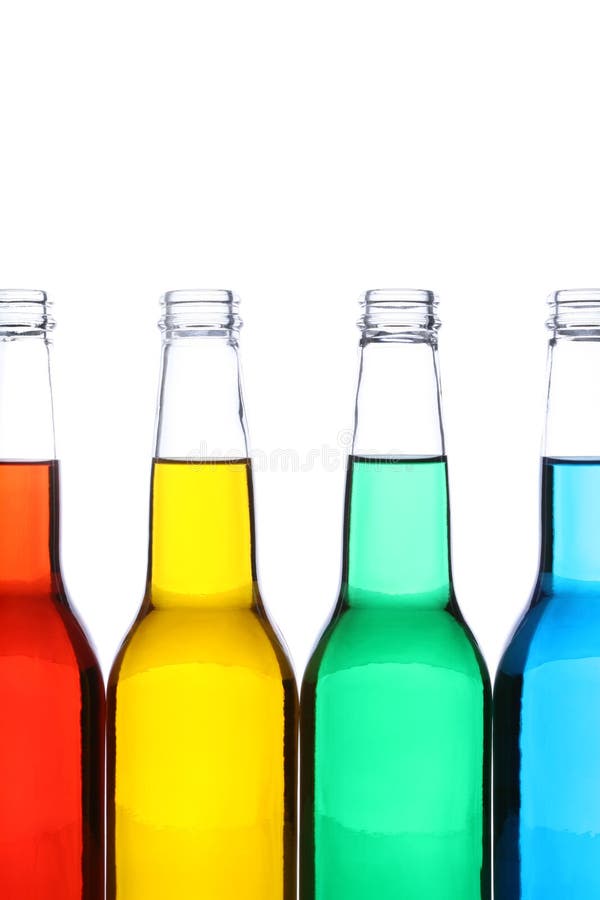 Glass bottles with red, yellow, green, and blue liquids, shot closeup isolated on white. Glass bottles with red, yellow, green, and blue liquids, shot closeup isolated on white