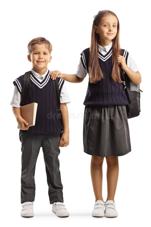 Fratello e sorella maggiore in uniforme scolastica immagini stock