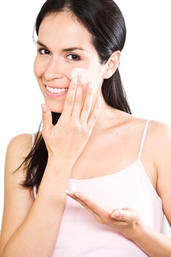 Frau, die Lotion anwendet stockfotografie Frau, die Lotion anwendet stockfotografie