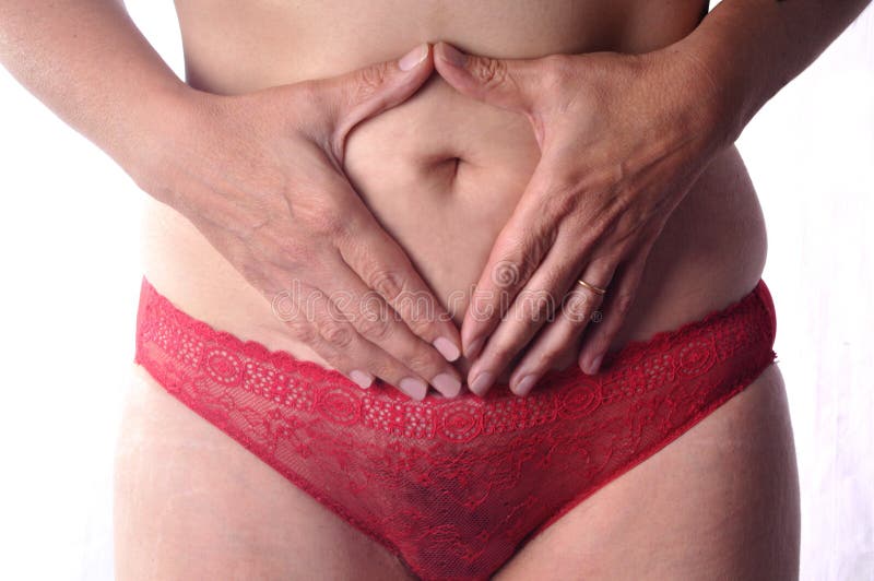 Frau, die Magenschmerzen hat lizenzfreies stockfoto Frau, die Magenschmerzen hat lizenzfreies stockfoto