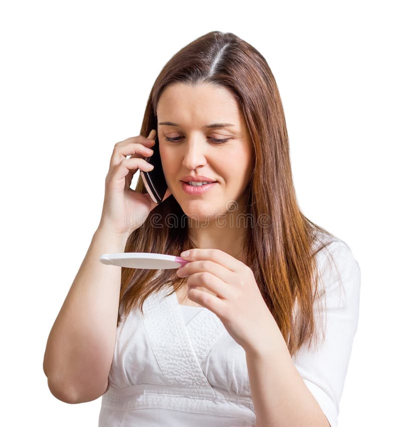 Frau mit Schwangerschaftstest und telefonisch sprechen stockbilder Frau mit Schwangerschaftstest und telefonisch sprechen stockbilder