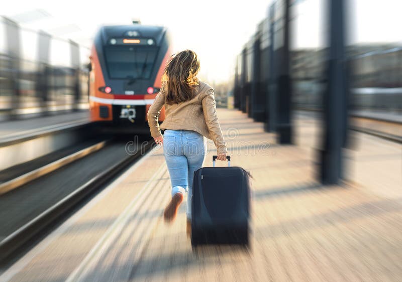 Woman late from train. Tourist running and chasing the leaving train in station. Person with stress pulling suitcase in platform. Rushing to get on. Woman late from train. Tourist running and chasing the leaving train in station. Person with stress pulling suitcase in platform. Rushing to get on.