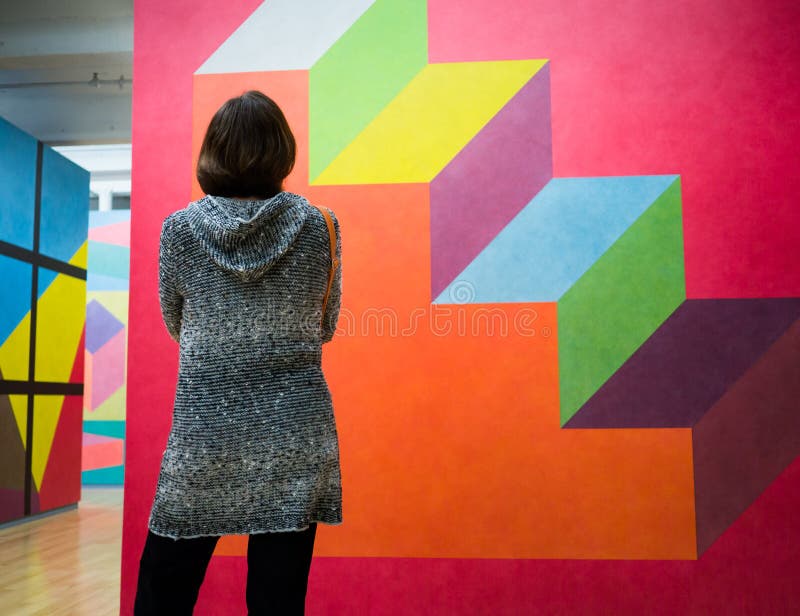 A women studies a painting by modern minimalist artist Sol LeWitt at Mass MoCA (Massachusetts Museum of Contemporary Art). Since opening in 1999, MASS MoCA has become one of the world's premier centers for making and showing the best art of our time. With annual attendance of 120,000, it ranks among the most visited institutions in the United States dedicated to new art. More than 80 major new works of art and more than 50 performances have been created through fabrication and rehearsal residencies in North Adams, making MASS MoCA perhaps the most fertile site in the country for new art. The museum thrives on making and presenting work that is fresh, surprising, and challenging. A women studies a painting by modern minimalist artist Sol LeWitt at Mass MoCA (Massachusetts Museum of Contemporary Art). Since opening in 1999, MASS MoCA has become one of the world's premier centers for making and showing the best art of our time. With annual attendance of 120,000, it ranks among the most visited institutions in the United States dedicated to new art. More than 80 major new works of art and more than 50 performances have been created through fabrication and rehearsal residencies in North Adams, making MASS MoCA perhaps the most fertile site in the country for new art. The museum thrives on making and presenting work that is fresh, surprising, and challenging.