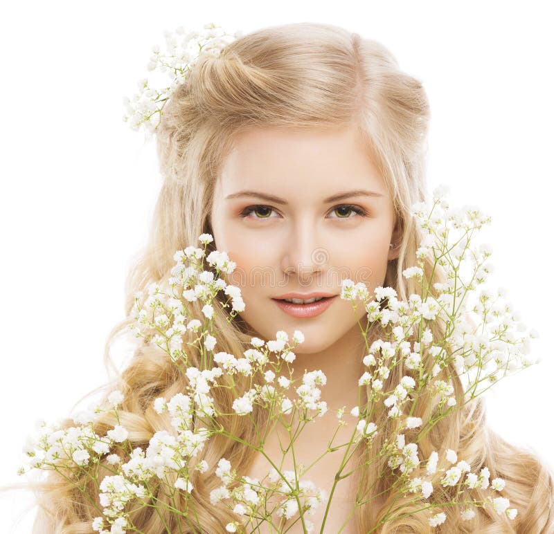 Woman Beauty Portrait, Young Girl with Flower and Blond Hair, Smooth Skin Makeup, Natural Cosmetics Concept, Isolated over White Background. Woman Beauty Portrait, Young Girl with Flower and Blond Hair, Smooth Skin Makeup, Natural Cosmetics Concept, Isolated over White Background