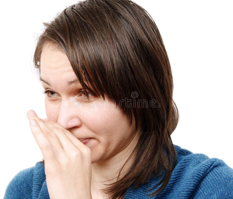 Young woman covering her nose. Young woman covering her nose
