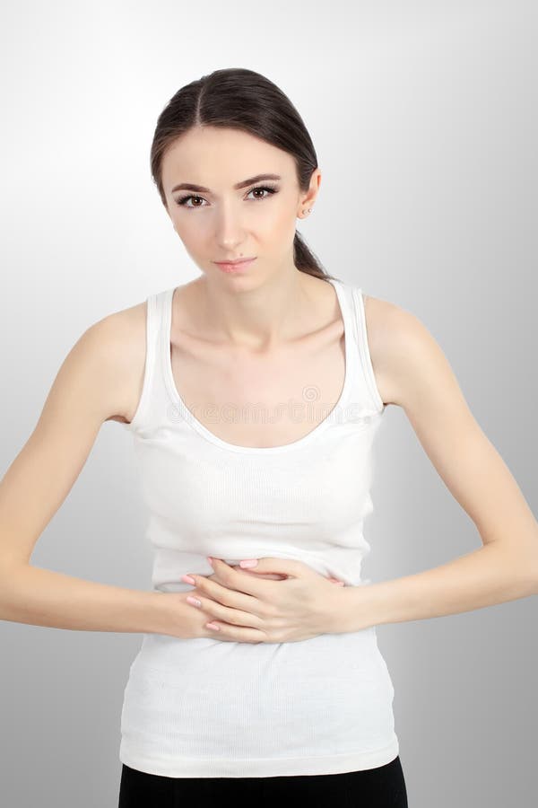 Frauengesundheit Schöne weibliche Gefühls-Schmerz im Magen lizenzfreies stockfoto