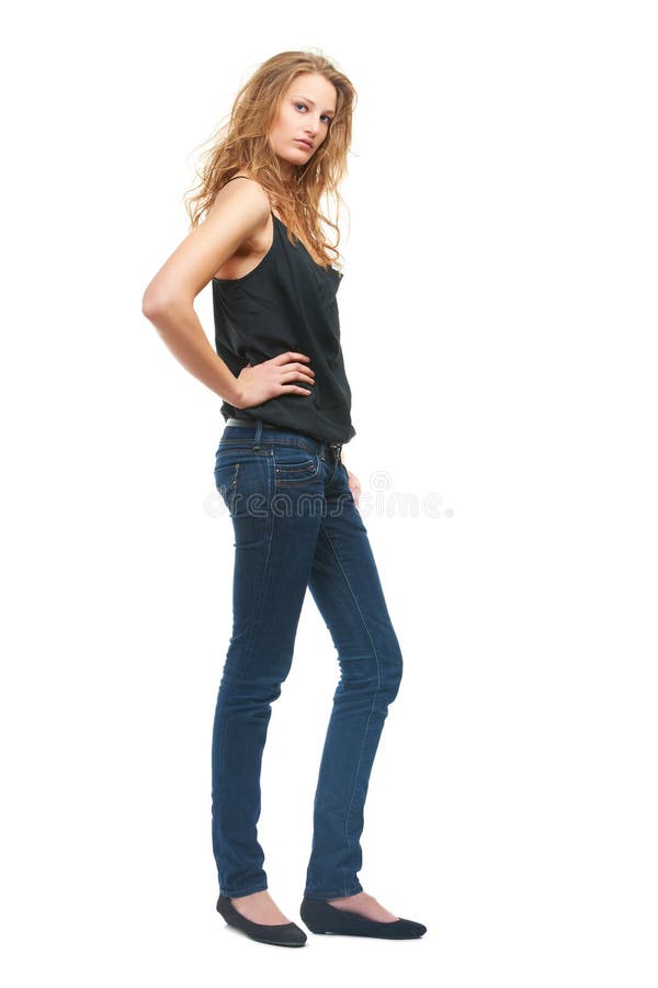 Frauenmode und Jeans im Studio für Portrait mit Selbstbewusstsein und isoliert von weißem Hintergrund. Person Mädchen oder lizenzfreies stockfoto
