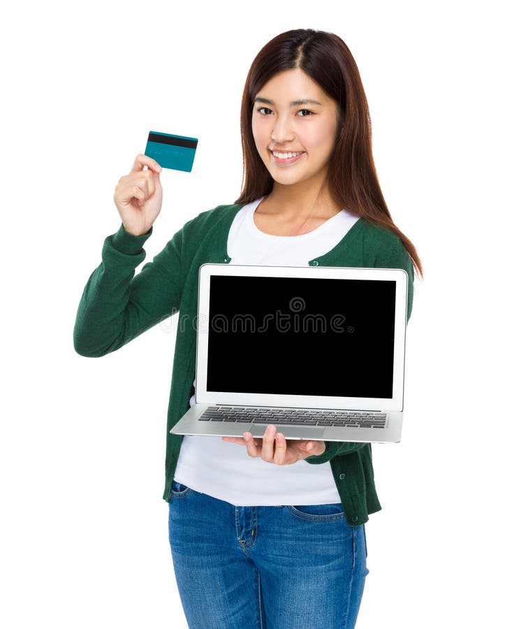 Frauenshow mit Laptop und Kreditkarte stockfotografie Frauenshow mit Laptop und Kreditkarte stockfotografie