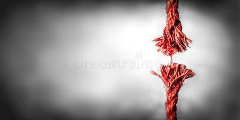 Frayed Red Rope Hanging By Last Thread On Black And White Background With Copy space. Frayed Red Rope Hanging By Last Thread On Black And White Background With Copy space