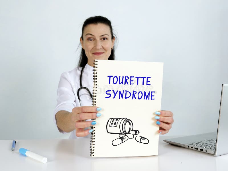 Fraza zespołu Tourette'a na ekranie. audytor korzysta z technologii komórkowych w biurze zdjęcia stock