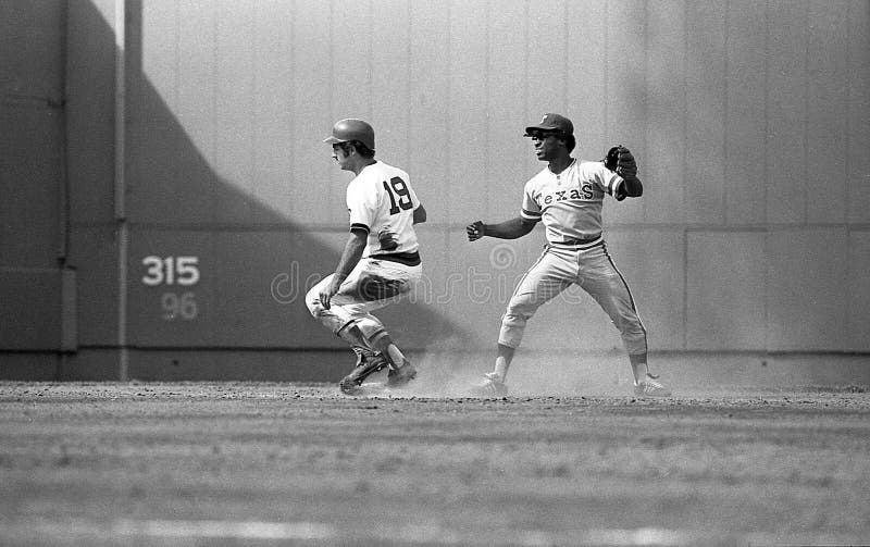 September 1, 1976.  Red Sox baserunner Fred Lynn uses a pop up slide after a seeing an errant throw not be handled by Rangers 2B Lenny Randle.  Image taken from a b&w negative. September 1, 1976.  Red Sox baserunner Fred Lynn uses a pop up slide after a seeing an errant throw not be handled by Rangers 2B Lenny Randle.  Image taken from a b&w negative.