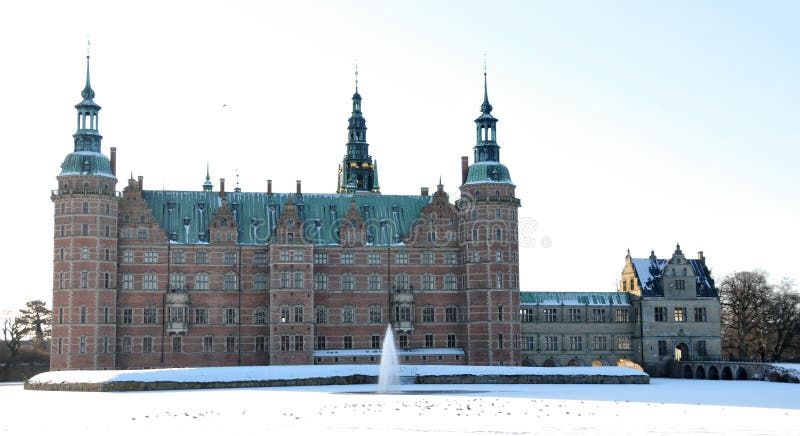 Frederiksborg Castle in Hilleroed, Denmark in the winter with frozen lake. Frederiksborg Castle in Hilleroed, Denmark in the winter with frozen lake