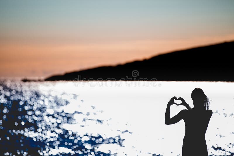 Free happy woman enjoying sunset..Embracing the golden sunshine glow of sunset,enjoying peace,serenity in nature stock images Free happy woman enjoying sunset..Embracing the golden sunshine glow of sunset,enjoying peace,serenity in nature stock images