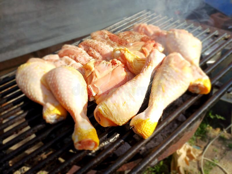 Free Range Chicken Thighs and Drumstick on the Charcoal Barbecue Stock