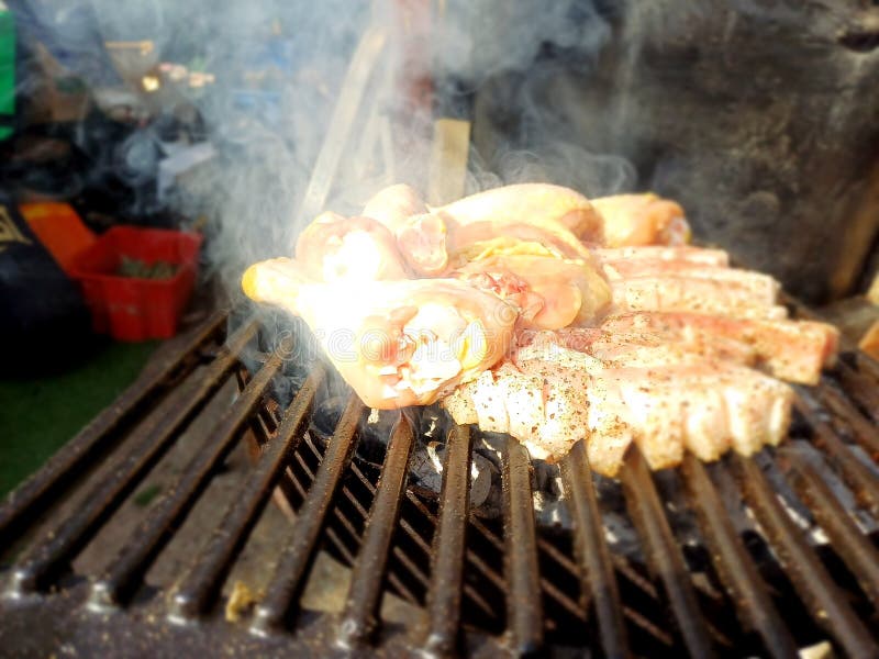 Free Range Chicken Thighs and Drumstick on the Charcoal Barbecue Stock