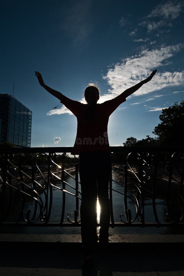 Free teenager embracing the sky