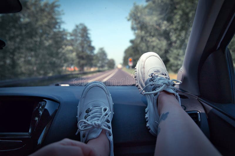 Freedom Car Travel Concept - Woman Relaxing with Feet on Dashboard Wearing  White Sneakers. Woman in the Car Stock Image - Image of human, girl:  183886641