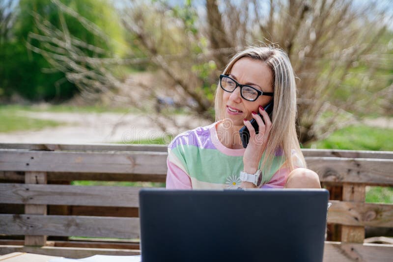 Freelance Blonde Woman With Glasses Works Outdoors Office Outside