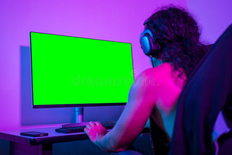 Freelance programmer doing a project from his computer. Replaceable screens to use content. royalty free stock photography