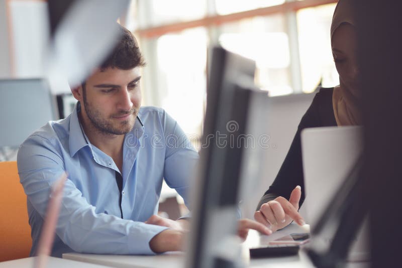 Freelance programmer working in startup office stock photography