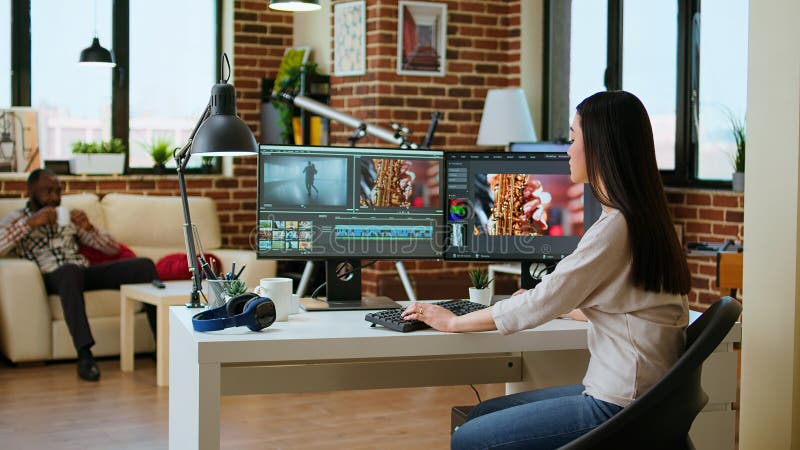 Freelancer asian woman video creator works on a movie project stock photography