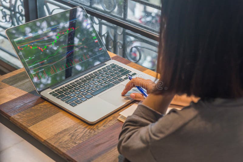 Freelancer investor watch the stock market on laptop royalty free stock image Freelancer investor watch the stock market on laptop royalty free stock image