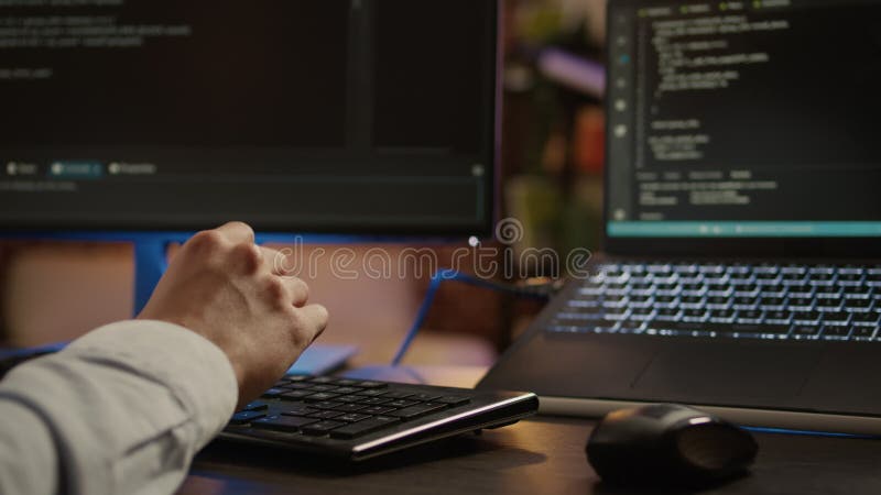 Freelancer programming binary code on software server, coding encryption system with firewall application. Hacking security program on network script for development. Close up. Handheld shot. Developer coding program video