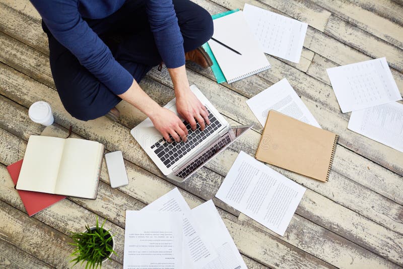 Freelancer Working on Floor royalty free stock photo Freelancer Working on Floor royalty free stock photo