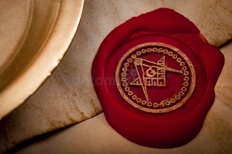 Freemason secret symbol concept with vintage letter under a candle, sealed with red wax seal with the square, the compass and the