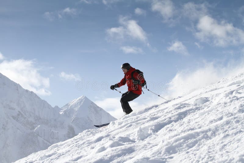 Skier is freeriding in backcountry. Skier is freeriding in backcountry