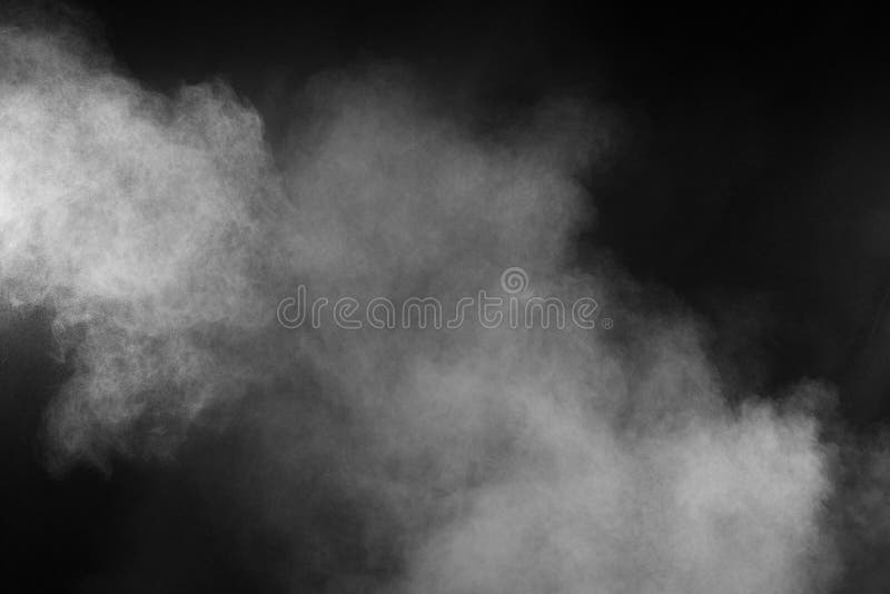 Freeze Motion Explosion of White Powder on a Black Background.Stopping