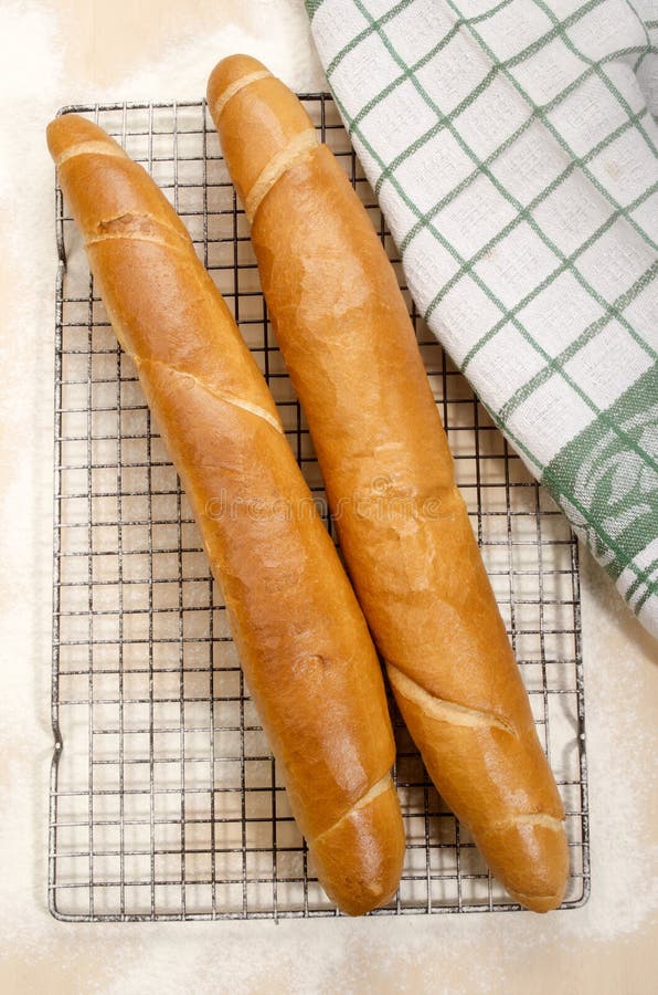 French Baguette on a Black Cooling Rack Stock Photo Image of crust, towel 59159802