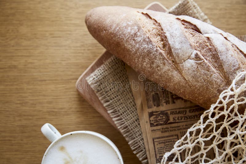 Baguette, European style bread on black wood table in morning time